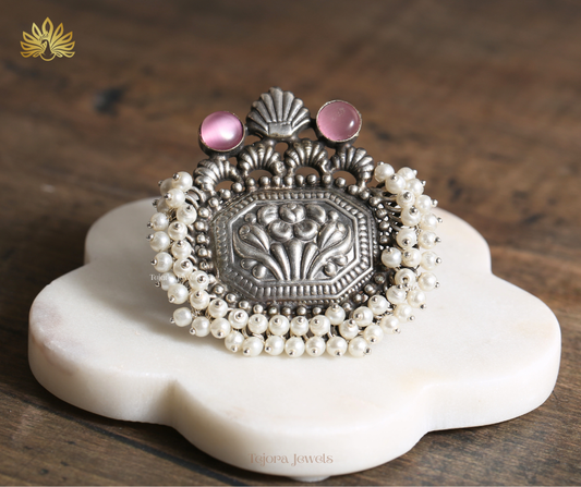 Stunning oxidized silver replica ring with intricate floral embossing, twin pink Monalisa stones, and cascading bandhai pearl ghungroos.